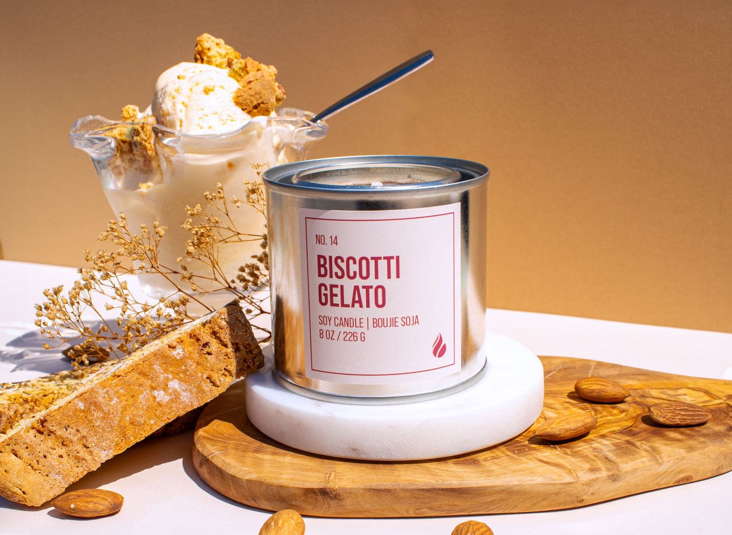 Product photograph of Biscotti Gelato displayed with props including a glass of gelato, almonds, and biscotti.