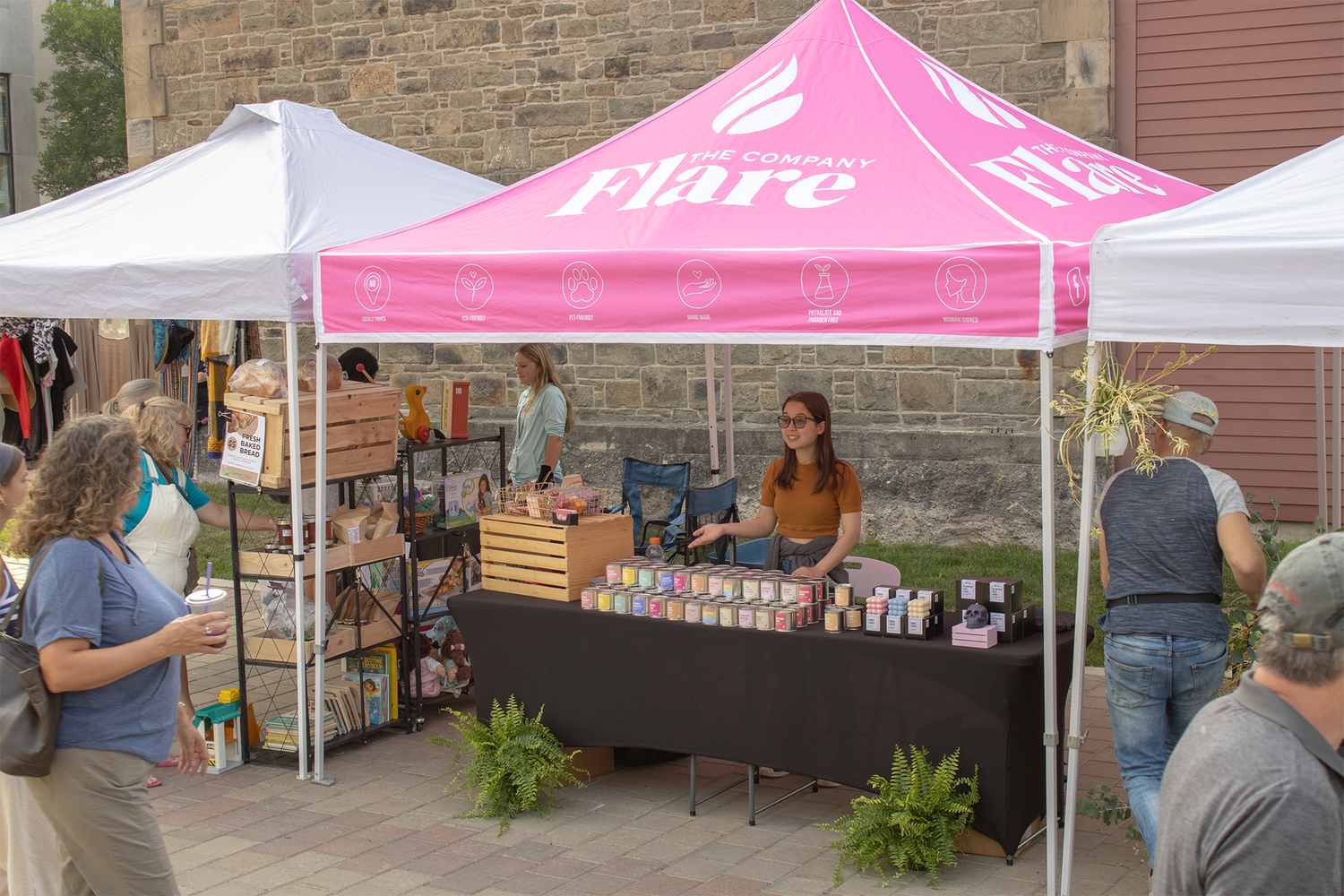 Picture of employee working at The Company Flare booth at the Garrison Night Market.