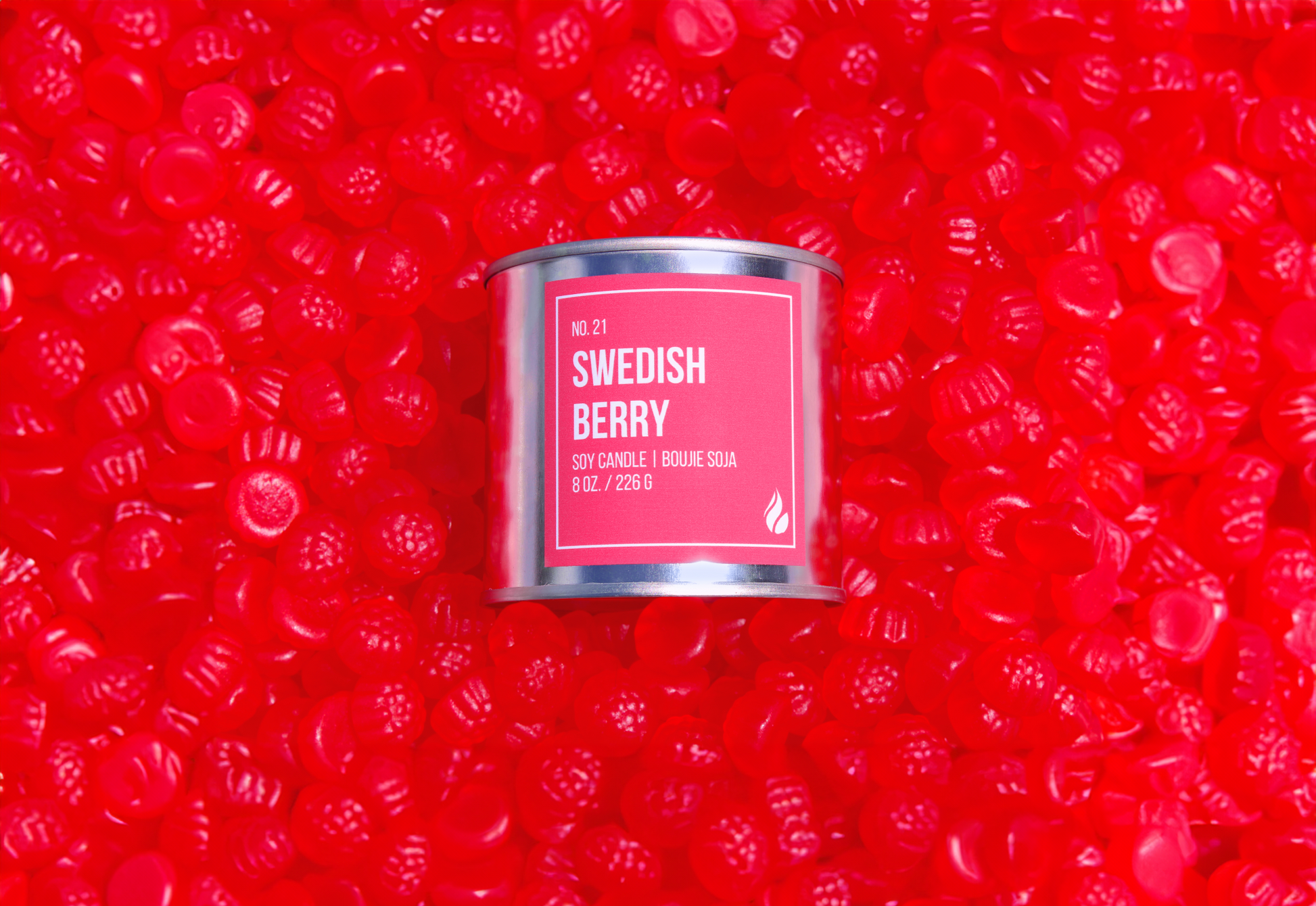 Candle labeled 'Swedish Berry' on a bed of Swedish Berries.