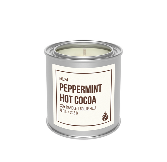 Candle in a metal paint can labeled 'Peppermint Hot Cocoa' on a white background.